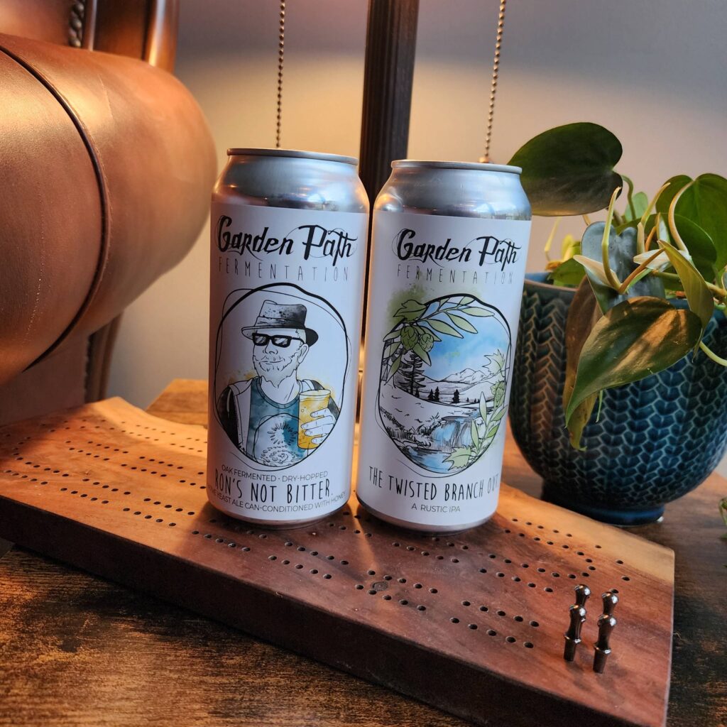 Photo of a can of The Twisted Branch Out and Rons Not Bitter beers from Garden Path Brewing